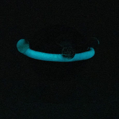 Empire Glassworks Galactic Spinner Cap glowing in dark, top view, for dab rigs