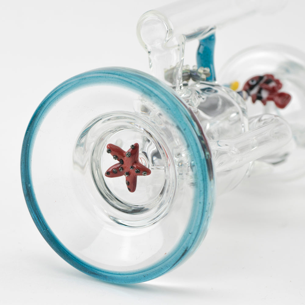 Empire Glassworks Recycler Dab Rig with intricate sea-themed glasswork, close-up view of bowl