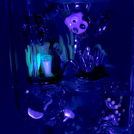 Empire Glassworks Recycler Dab Rig with intricate Under The Sea theme, side view on dark background