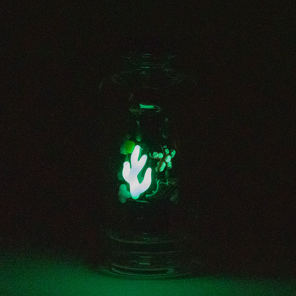 Empire Glassworks "Save the Seas" Puffco Peak attachment glowing in dark, front view