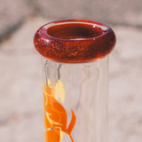 Close-up of 18" AFM Phoenix 9mm Beaker Bong's mouthpiece with sparkling red detail