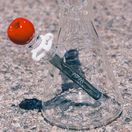 AFM 18" Atlanta Baseball Beaker Bong with red bowl, side view on concrete
