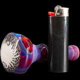 Chris Lezak Glass Spoon Pipe with Black & White Reversal Pattern and Opal Marble, next to Lighter