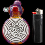 Lezak Glass Reversal Sherlock Pipe with intricate design, front view next to lighter for scale