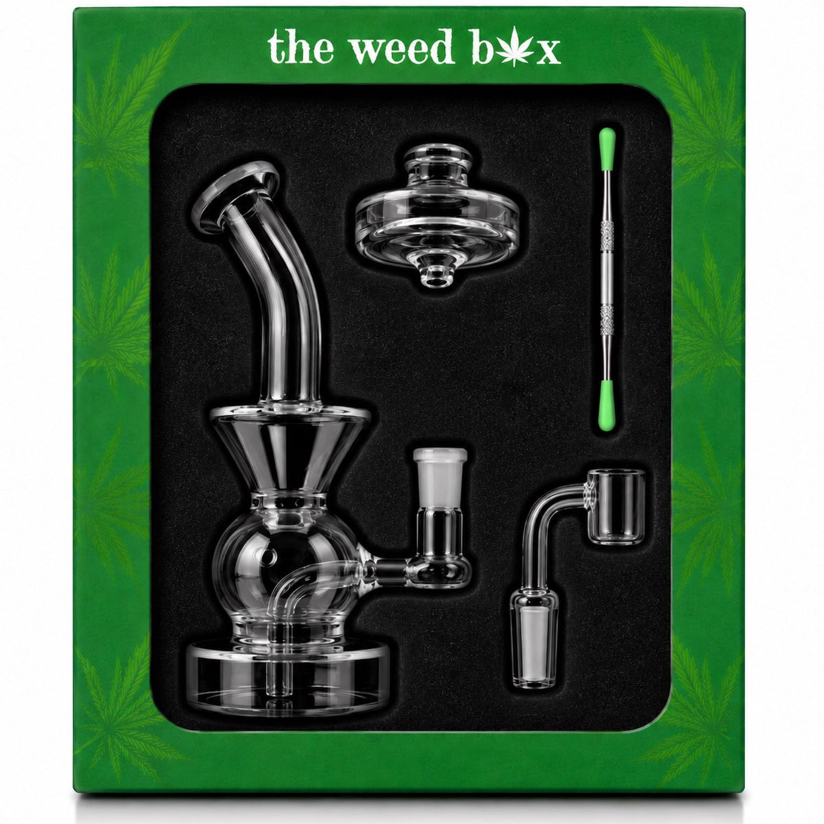 The Weed Box Ultimate Dabber Kit laid out in branded green packaging with rig, banger, cap, and dabber tool