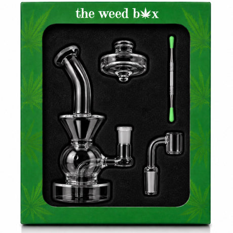 The Weed Box Ultimate Dabber Kit laid out in branded green packaging with rig, banger, cap, and dabber tool