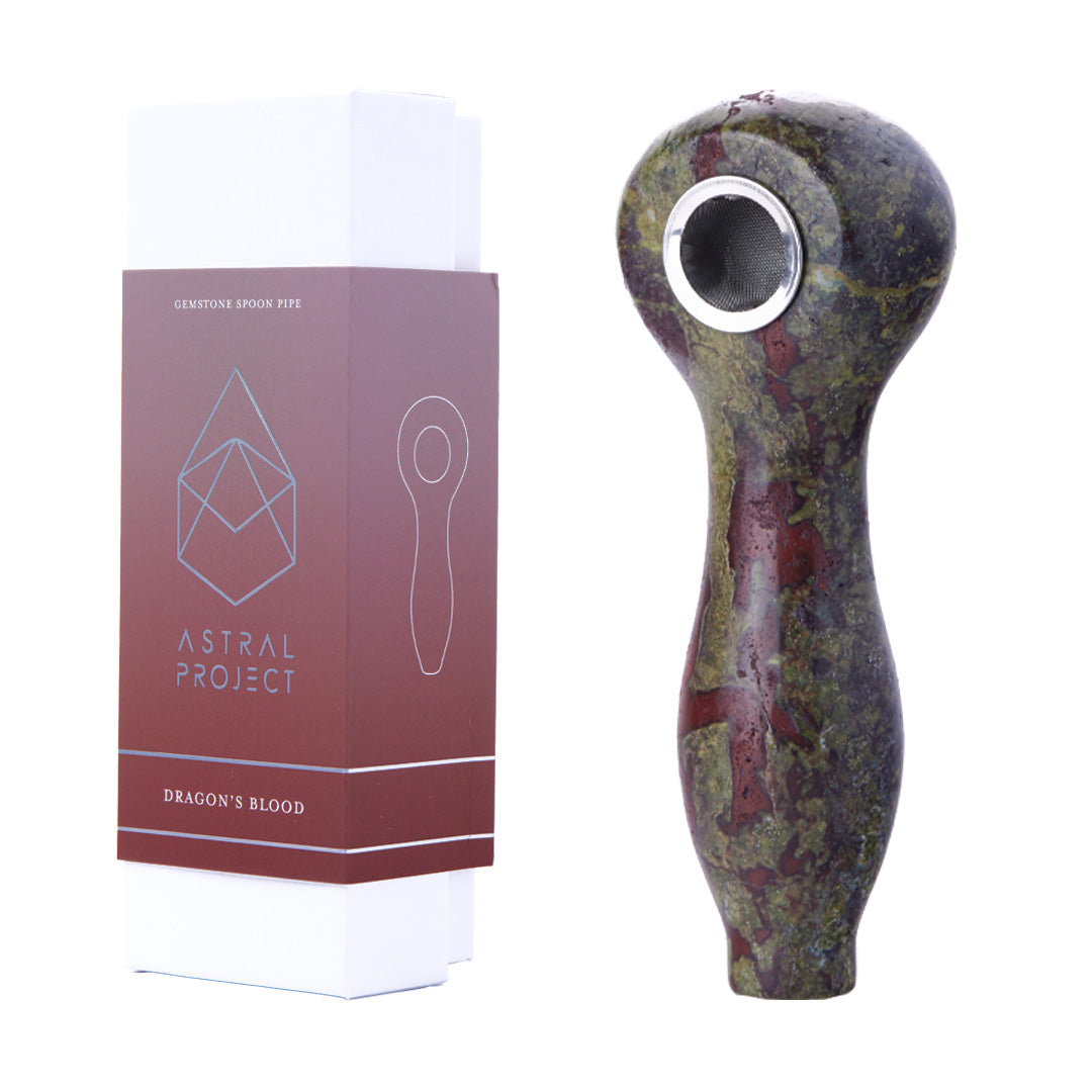 Astral Project Gemstone Spoon Pipe in Dragon's Blood variant beside packaging, side view