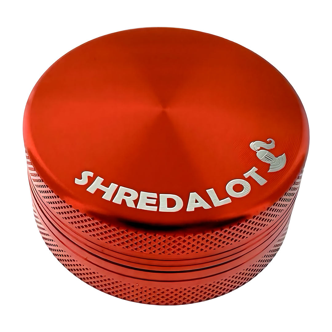 Sir Shredalot 2-part Grinder in red with textured grip and logo, top view on white background