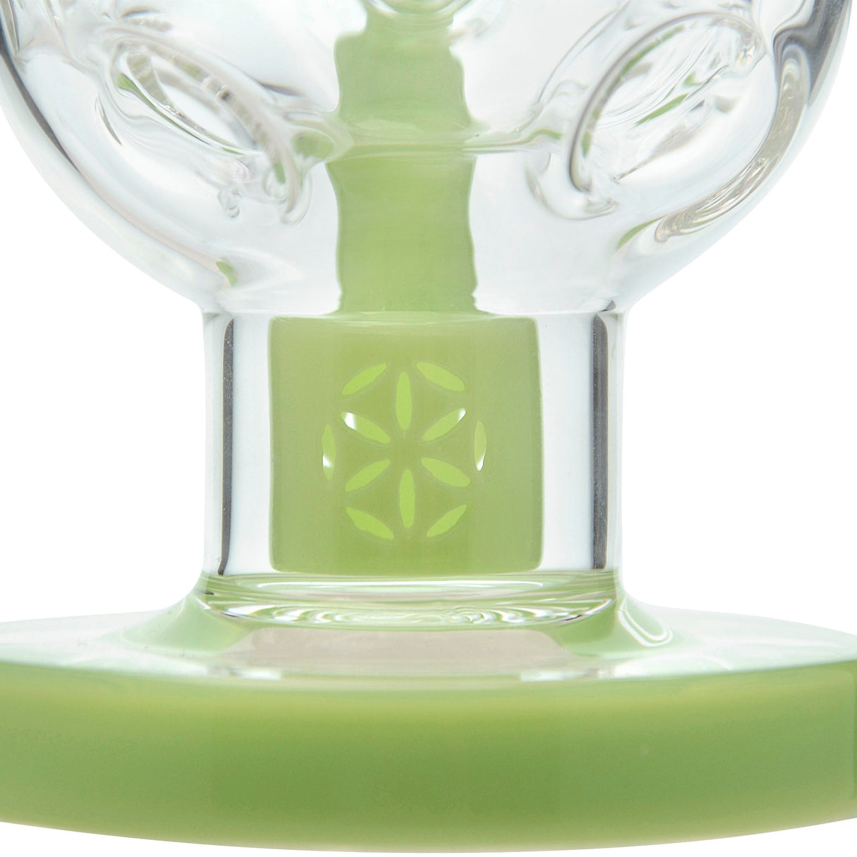 Close-up of Calibear Fab Egg Seed Of Life Dab Rig with green color accents and borosilicate glass
