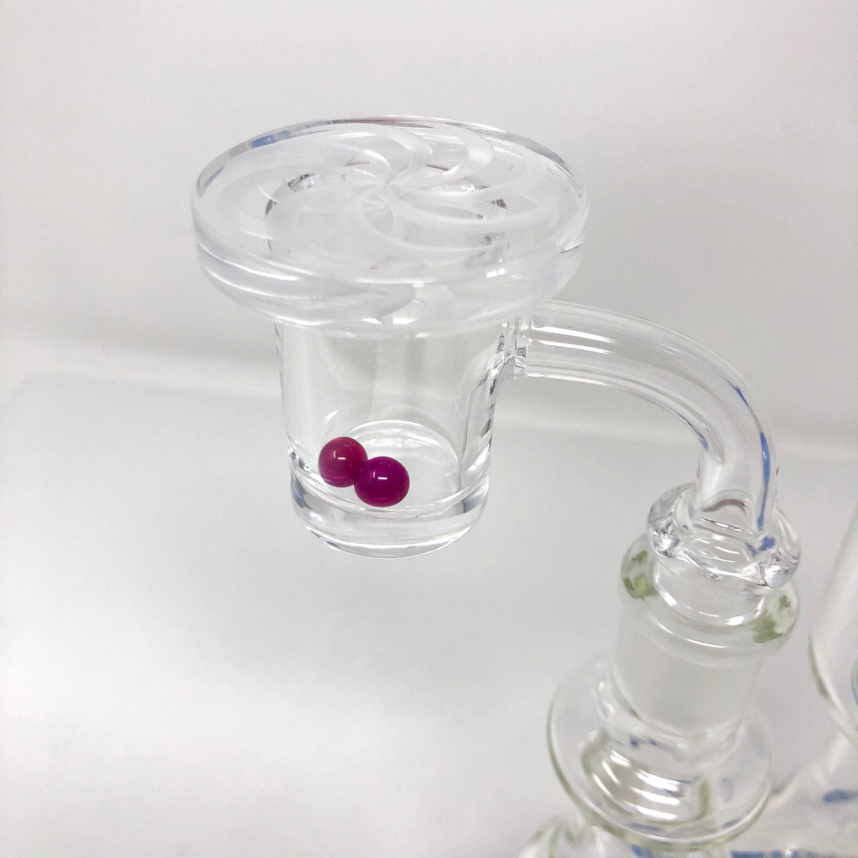 AFM Disc Spinner Carb Cap made of Borosilicate glass, angled view showing spinning function