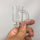 AFM 25mm E-Nail Quartz Banger held in hand, clear view of bucket and joint