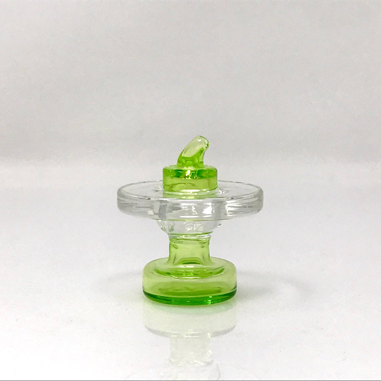 AFM Knob Air Flow Directional Carb Cap in vibrant green, front view on seamless white background