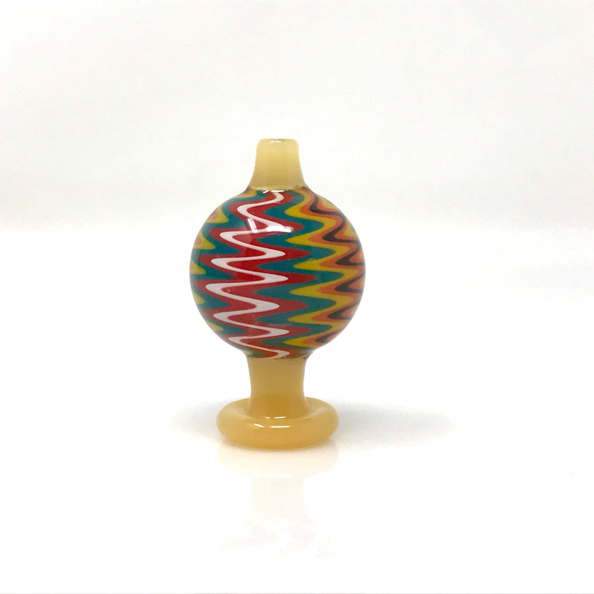 AFM Color Reversal Bubble Carb Cap front view, borosilicate glass with vibrant zigzag pattern