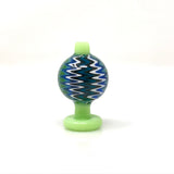 AFM Color Reversal Bubble Carb Cap with zigzag pattern and green base, front view on white background