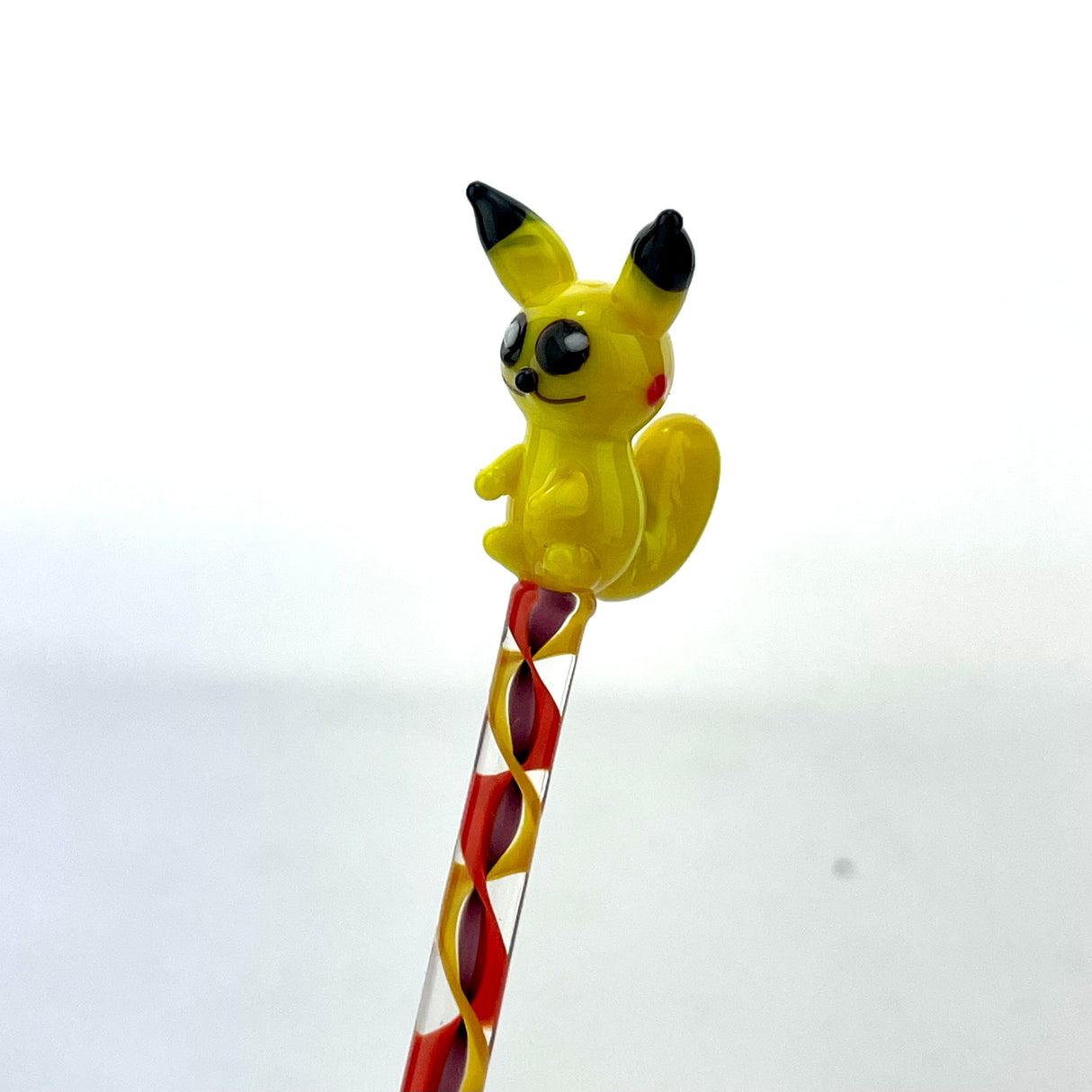 AFM Pikachu Glass Dabber Tool with red and white spiral handle, front view on a white background