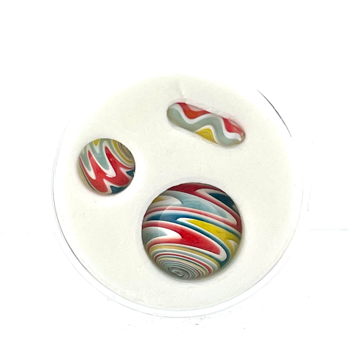 AFM Mini Terp Slurper Reversal Marble Pill Set with colorful swirl patterns, top view on white background