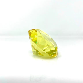 AFM Diamond Spinner Cap in yellow borosilicate, angled view on seamless white background