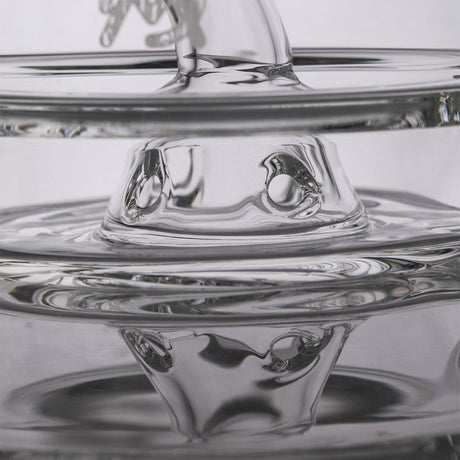 Close-up of MJ Arsenal Apex Mini Rig joint with borosilicate glass and quartz bucket