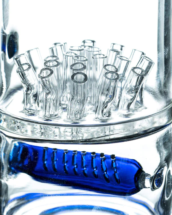 Close-up of 1Stop Glass 19" Coiled Glycerin Bong's in-line percolator and blue glycerin coil