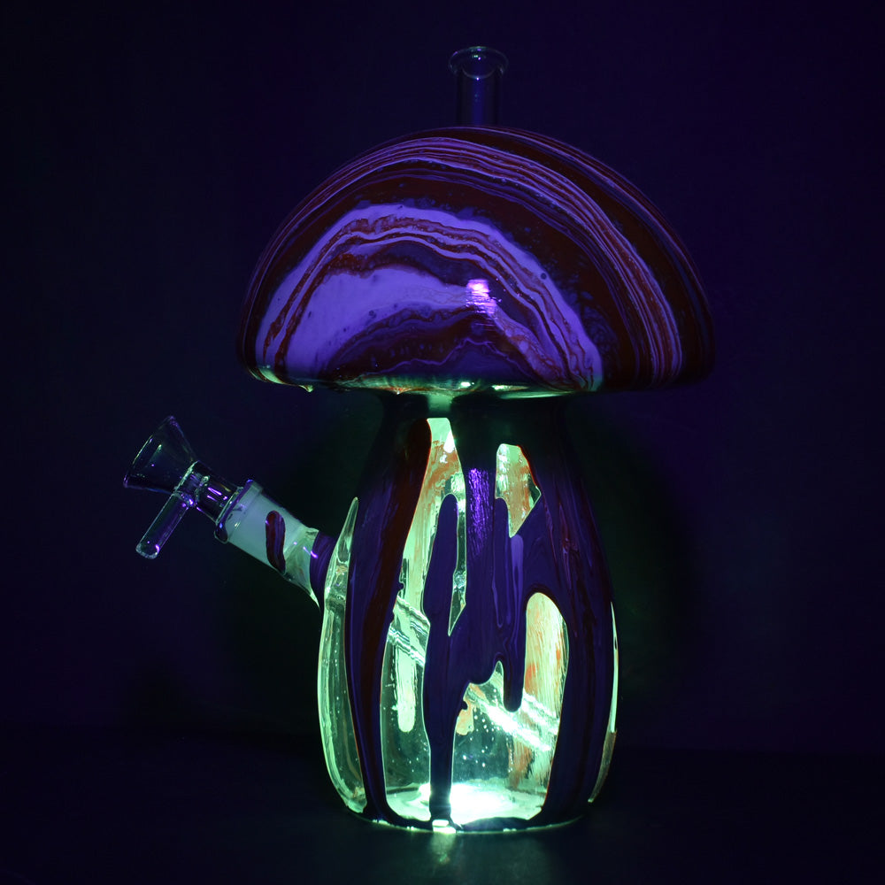 Dabtized Trippy Mushroom LED Water Pipe with illuminated colored glass, front view on dark background