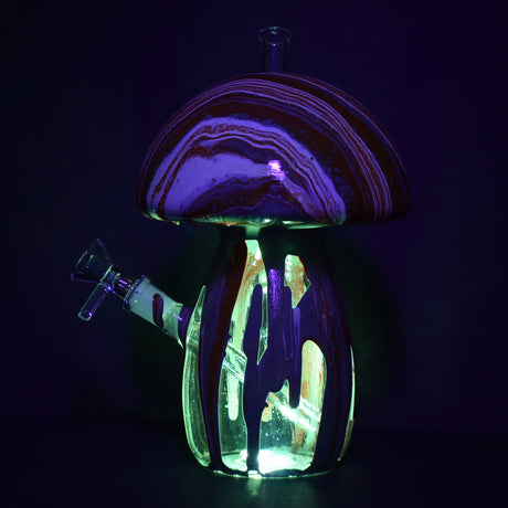 Dabtized Trippy Mushroom LED Water Pipe with illuminated colored glass, front view on dark background