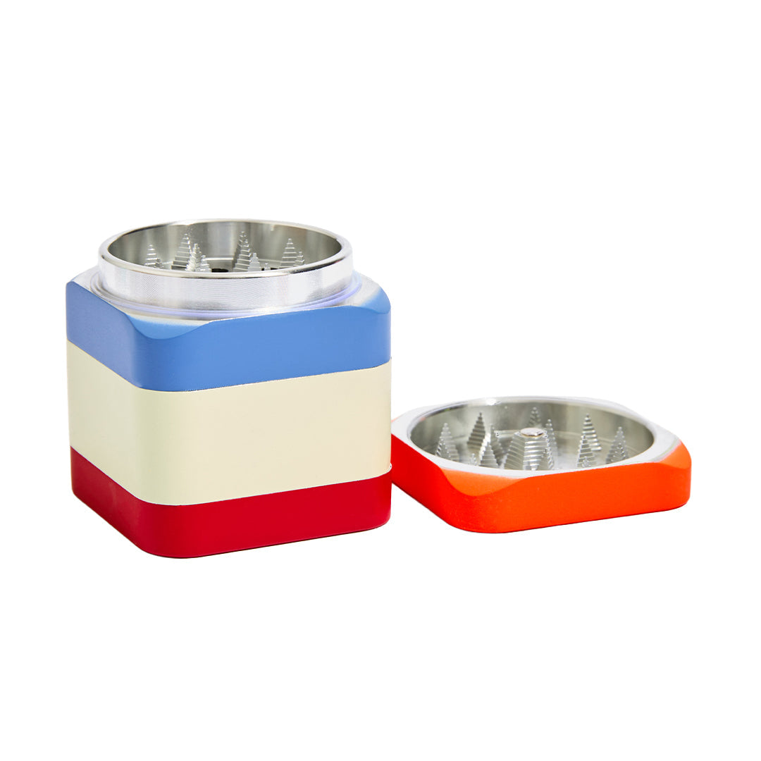 Edie Parker Colorblock grinder with magnetic closure lid