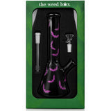 The Weed Box 10 inch Purple Bat beaker bong in branded green packaging, matte black glass with purple bats