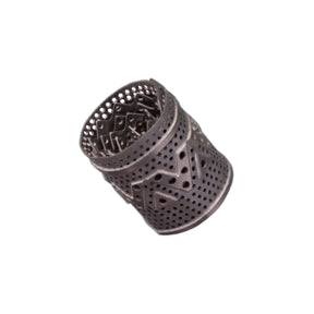 DynaVap DynaCoil titanium concentrate adapter shown lying horizontally to display its coiled shape