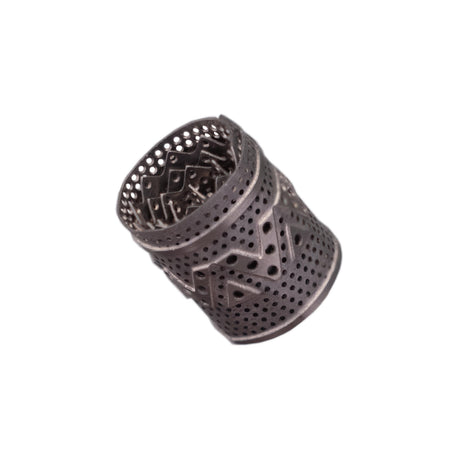 DynaVap DynaCoil titanium concentrate adapter shown lying horizontally to display its coiled shape