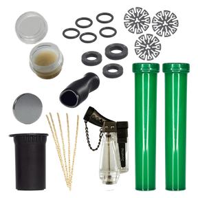 DynaKit Deluxe by DynaVap featuring maintenance tools, storage tubes, and lighter, top view