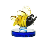 Colorful Air Spin Channel Carb Cap with Bee Design on Blue Stand, Front View