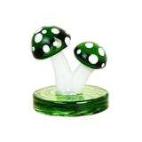 Mushroom-shaped Air Spin Channel Carb Cap on green base for dab rigs, top view