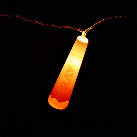 RAW Cone LED Party Light glowing orange, close-up view, part of a string set
