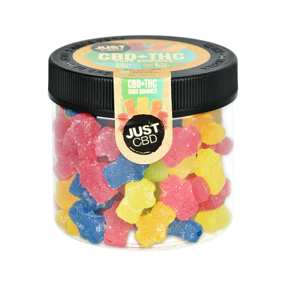 Front view of JUST CBD + THC Sour Gummies in clear jar, assorted colors, by JUST CBD