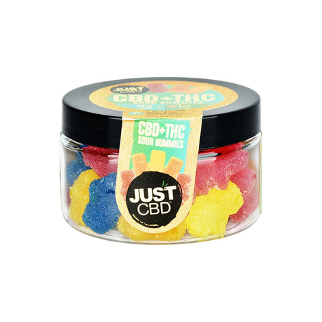 Front view of JUST CBD + THC Sour Gummies in a clear jar, showcasing assorted colors and shapes