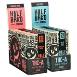 Half Baked THCA Vape Cartridge 2g display with Hawaiian Snow and Blue Face variants