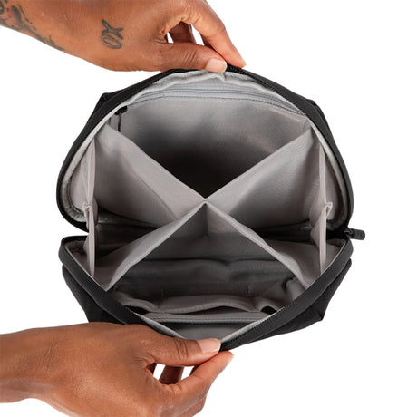 PAX Smell Proof Bag open view showcasing interior compartments, held by a person