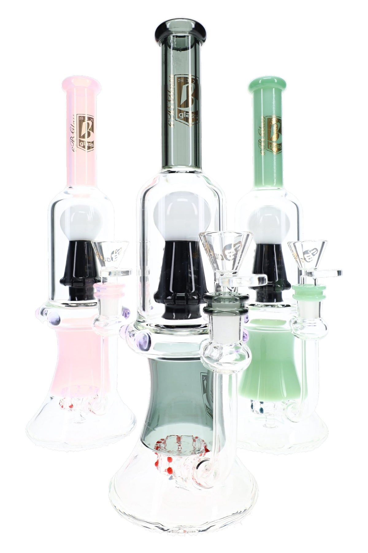 Three 6B Glass skull perc bongs in pink, gray, and mint green, each with a black and white skull percolator