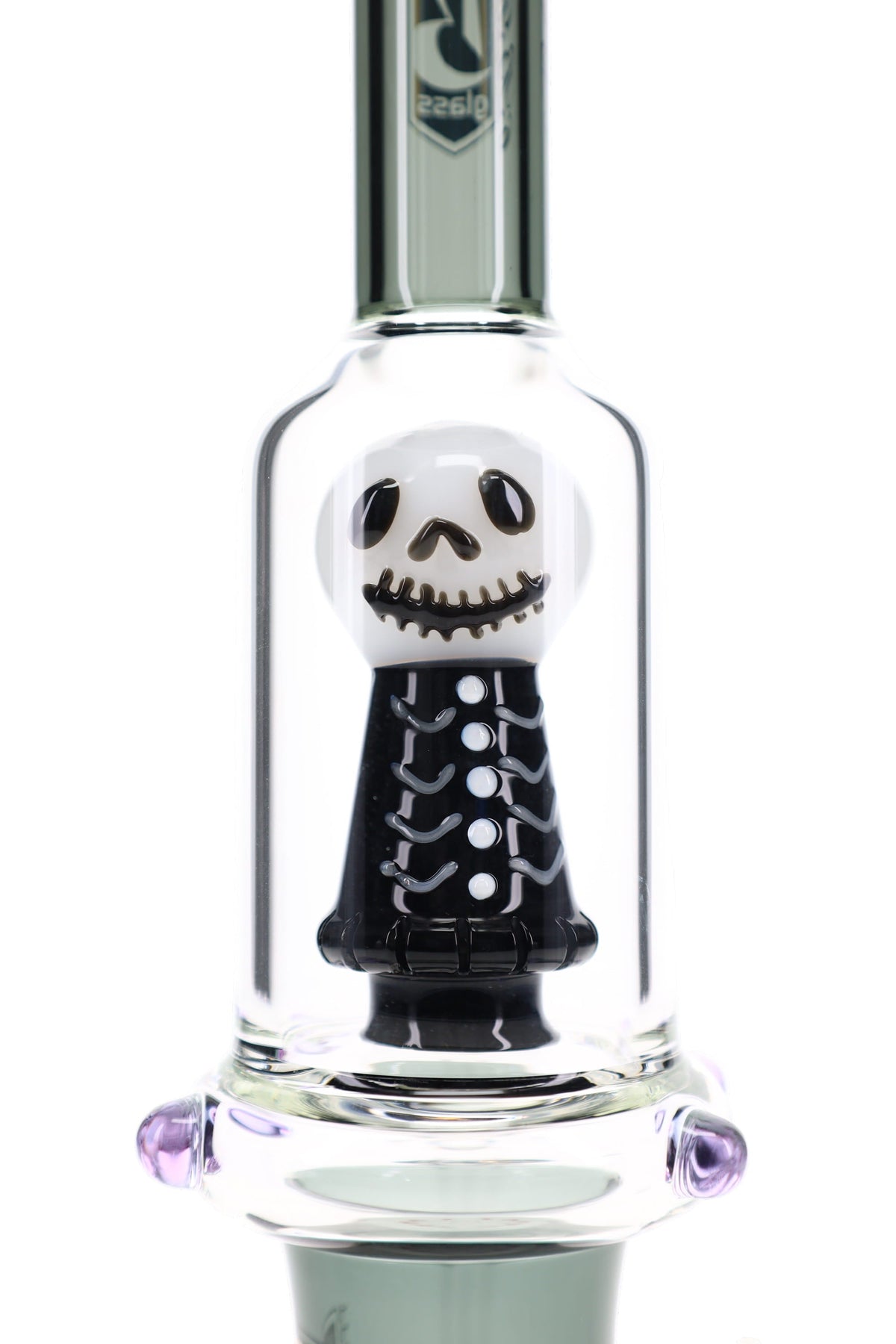 Close view of the white and black sculpted skull percolator inside the clear chamber of the 6B Glass bong