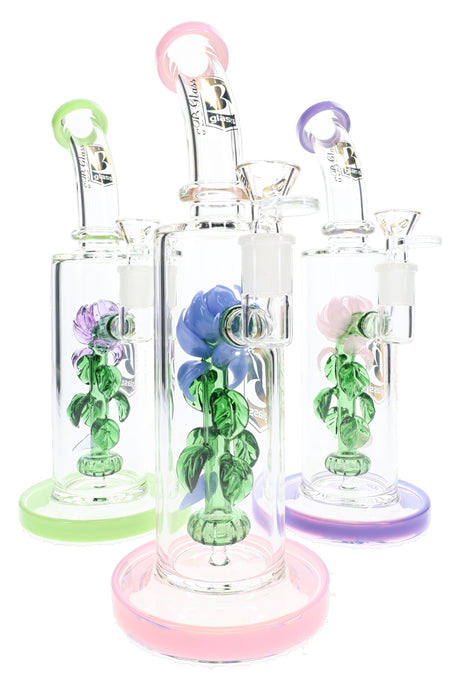 Three 6B Glass rose perc bongs with green, pink, and purple bases and glass roses inside clear chambers