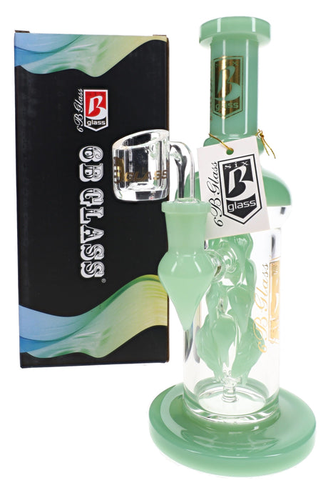 6B Glass vine leaf perc dab rig in mint green glass with a leaf percolator, shown next to its black retail box