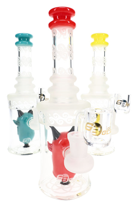 Three 6B Glass frosted demon perc dab rigs with red, teal, and yellow mouthpieces and frosted necks