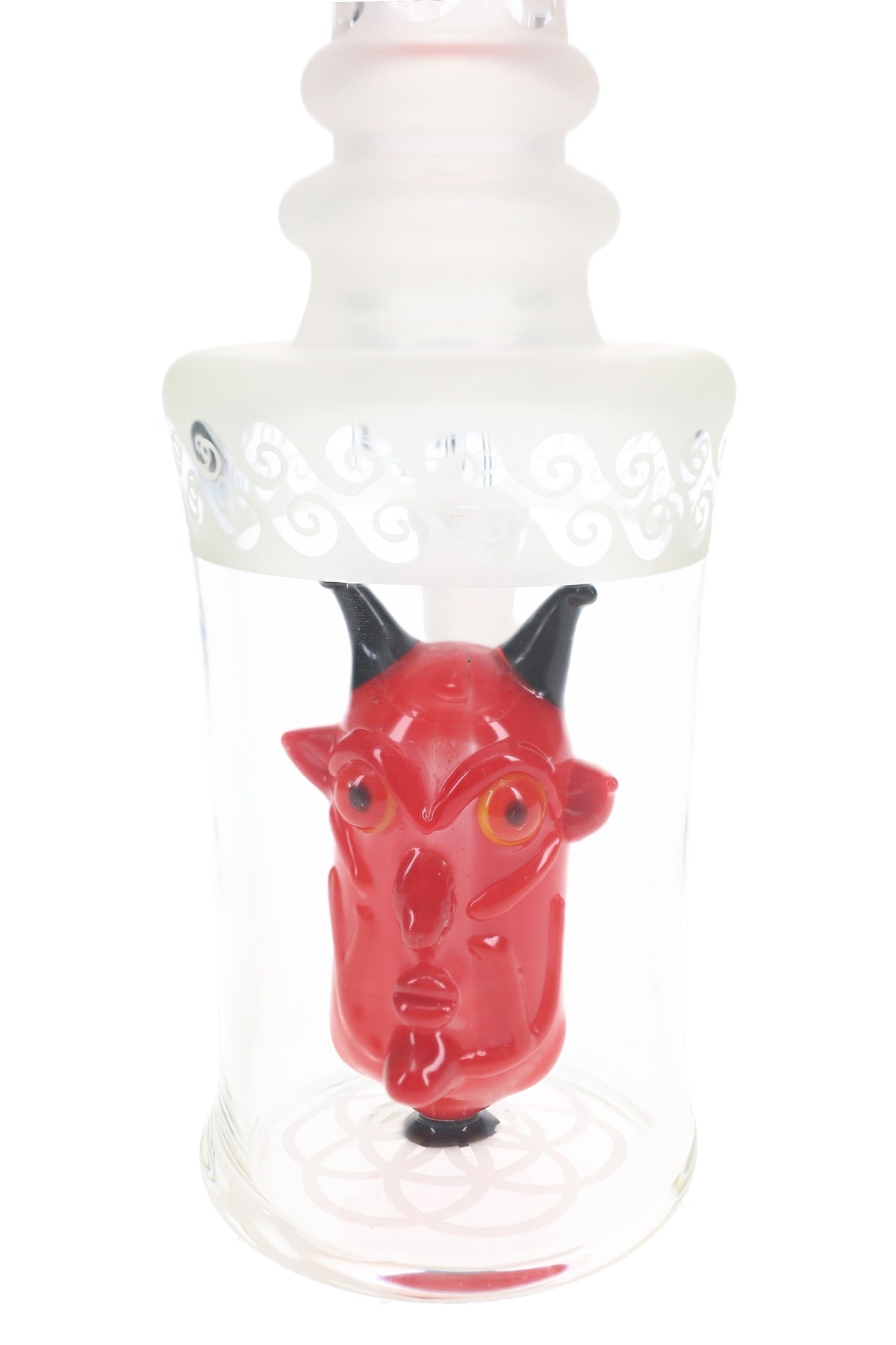 Close view of the red horned demon head percolator inside the clear chamber of the 6B Glass dab rig