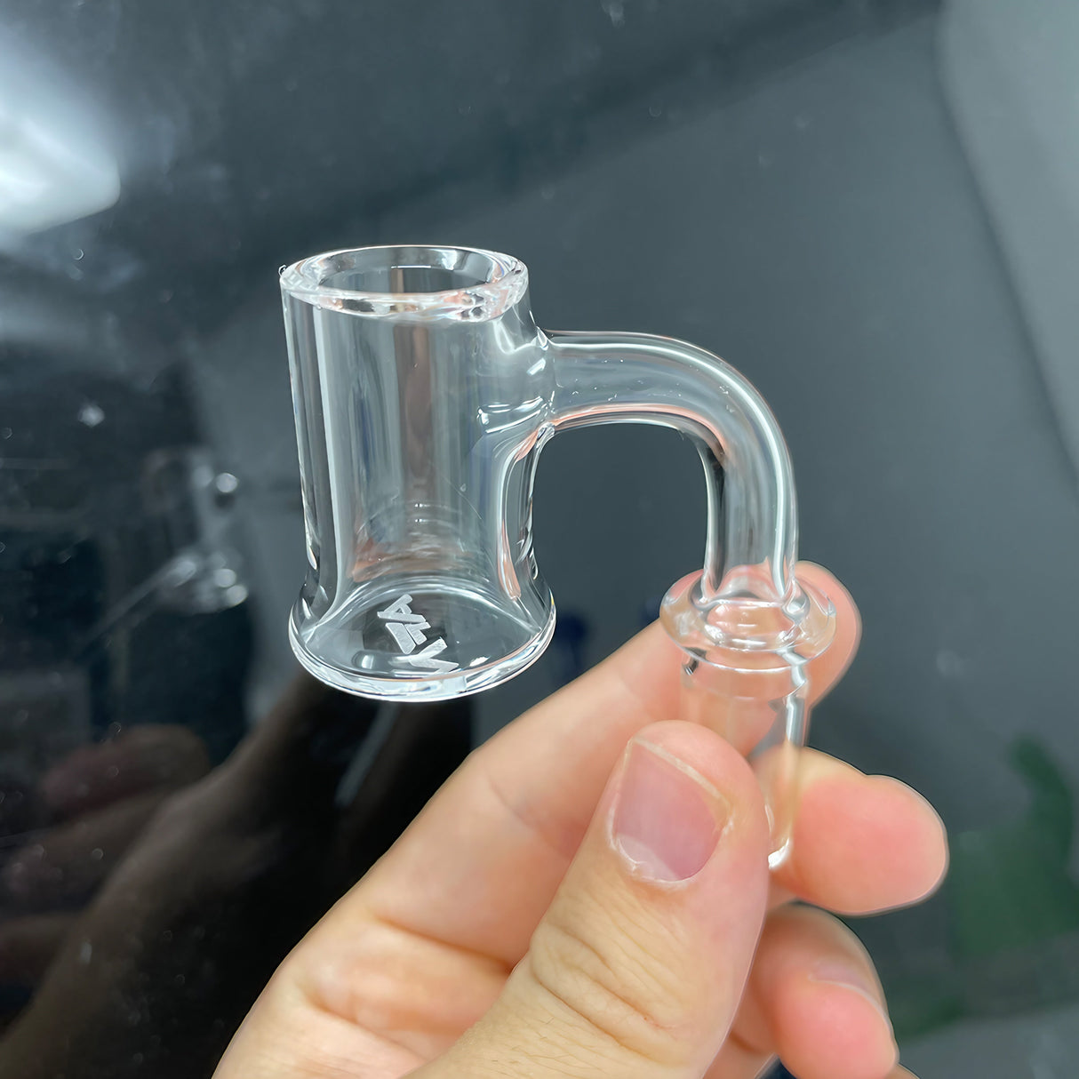 AFM Full Weld Bell Bottom 20mm Quartz Banger held in hand, clear view for concentrates
