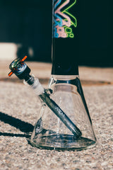 AFM The Trippy Neon Beaker Set, 18" Borosilicate Glass Bong for Dry Herbs, Side View on Concrete