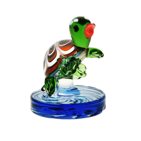 Green and white mushroom-themed Air Spin Channel Carb Cap on blue base, front view, for dab rigs