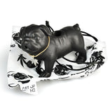 Art of Smoke Pug Life Ceramic Pipe in black, side view on printed cloth, compact and novelty design