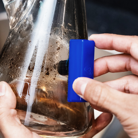 Close-up of BoroBuddy™ Magnetic Cleaner by Snowtree in action on a bong