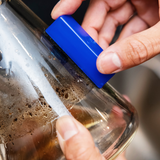 Close-up of BoroBuddy™ Magnetic Cleaner by Snowtree in action on a bong