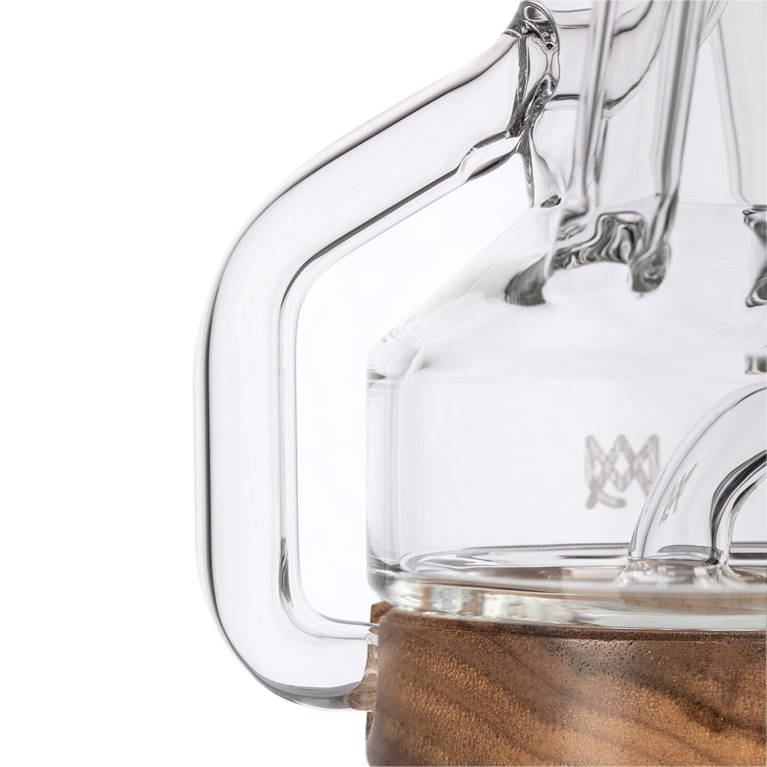 Close-up side view of MJ Arsenal Apex Mini Rig with borosilicate glass and quartz bucket